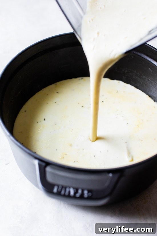 Lightened-Up Clam Chowder Recipe 4 Pouring chowder into pot from blender
