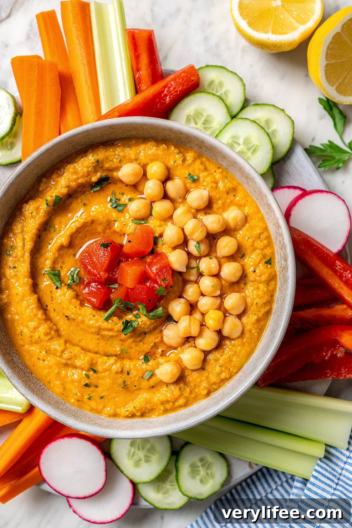 Overhead view of homemade roasted red pepper hummus