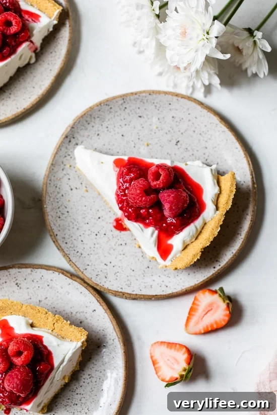 No-Bake Cheesecake topped with berries Overhead view of no-bake cheesecake on plate topped with berries