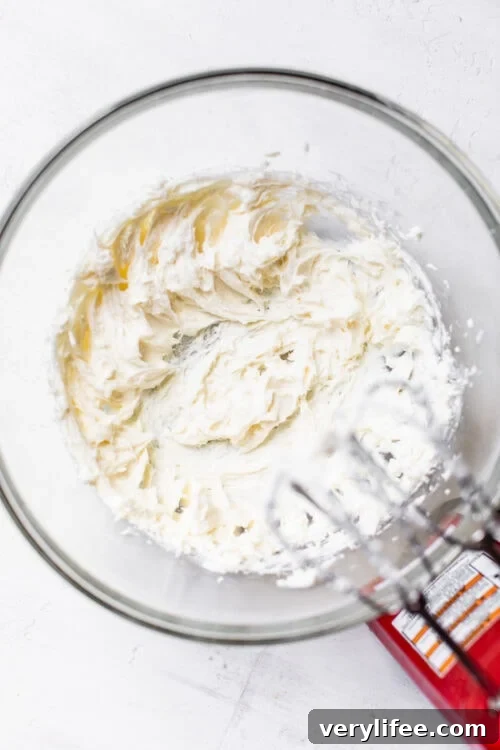 Creamy No-Bake Cheesecake Recipe 2 Beating no-bake cheesecake filling in mixing bowl