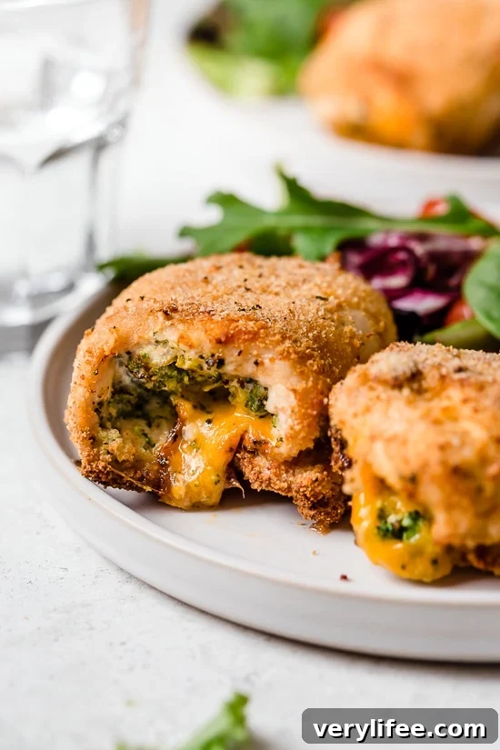 Broccoli and Cheese Stuffed Chicken is filled with cheddar and broccoli, then rolled up, breaded and baked in the oven or air fryer!