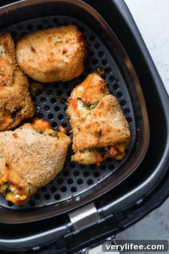 Broccoli and Cheese Stuffed Chicken is filled with cheddar and broccoli, then rolled up, breaded and baked in the oven or air fryer!