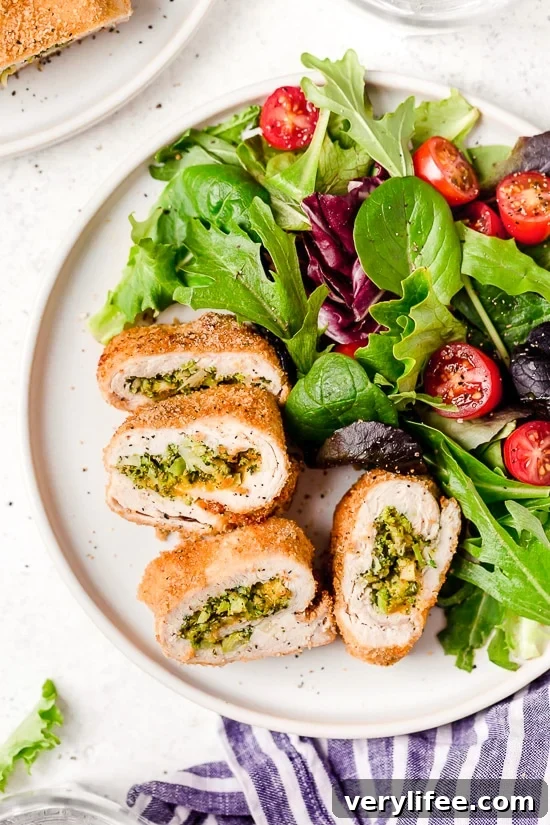 Broccoli and Cheese Stuffed Chicken is filled with cheddar and broccoli, then rolled up, breaded and baked in the oven or air fryer!