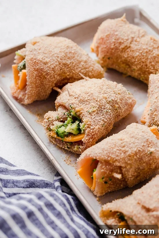 Broccoli and Cheese Stuffed Chicken is filled with cheddar and broccoli, then rolled up, breaded and baked in the oven or air fryer!