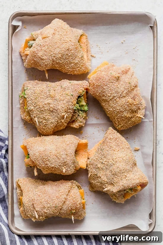 Broccoli and Cheese Stuffed Chicken is filled with cheddar and broccoli, then rolled up, breaded and baked in the oven or air fryer!
