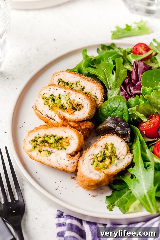 Broccoli and Cheese Stuffed Chicken is filled with cheddar and broccoli, then rolled up, breaded and baked in the oven or air fryer!