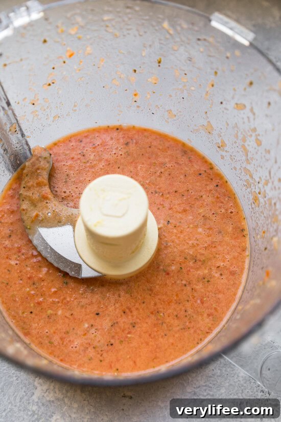 Make the dressing Tomato red wine vinaigrette in food processor bowl