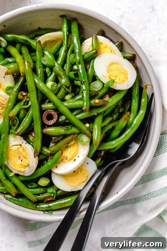 Green bean salad with olives and hard-boiled eggs.