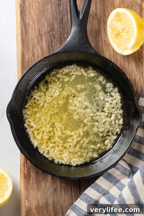 Crispy Oven Baked Tilapia with Lemon and Herbs 2 Garlic butter lemon sauce in skillet