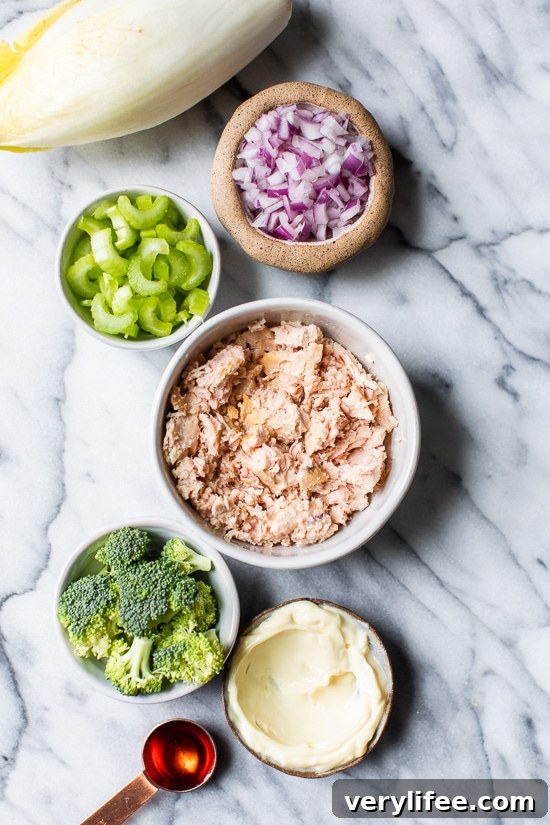 Tuna Salad loaded with veggies served in endive leaves make a quick and easy, low-carb lunch.