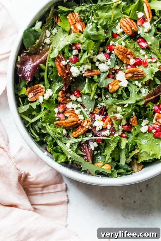 Baby Greens Salad with Pomegranate, Gorgonzola and Pecans 2 This beautiful, delicious fall or winter salad is made with mixed baby greens, pomegranate, gorgonzola and pecans with a pomegranate vinaigrette.