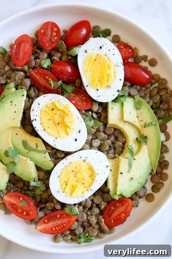 Hard boiled eggs in salads Overhead view of lentil salad with avocado and hard boiled eggs