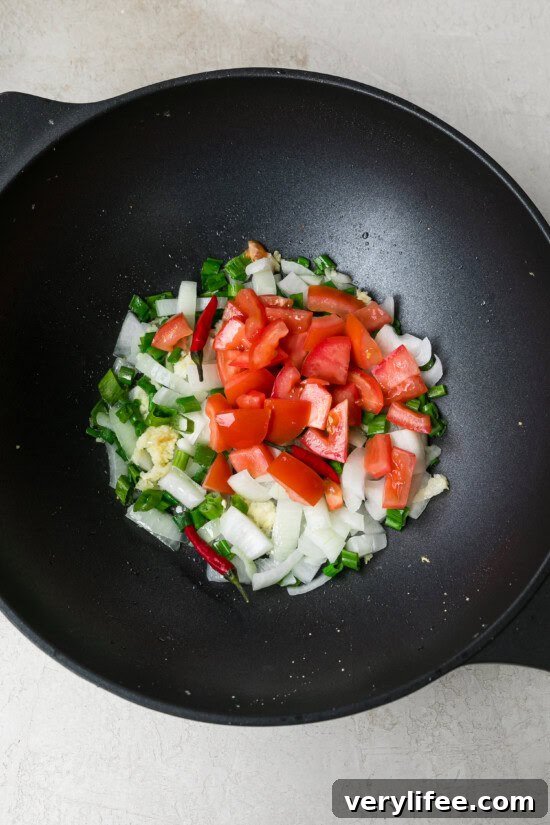 add veggies to wok