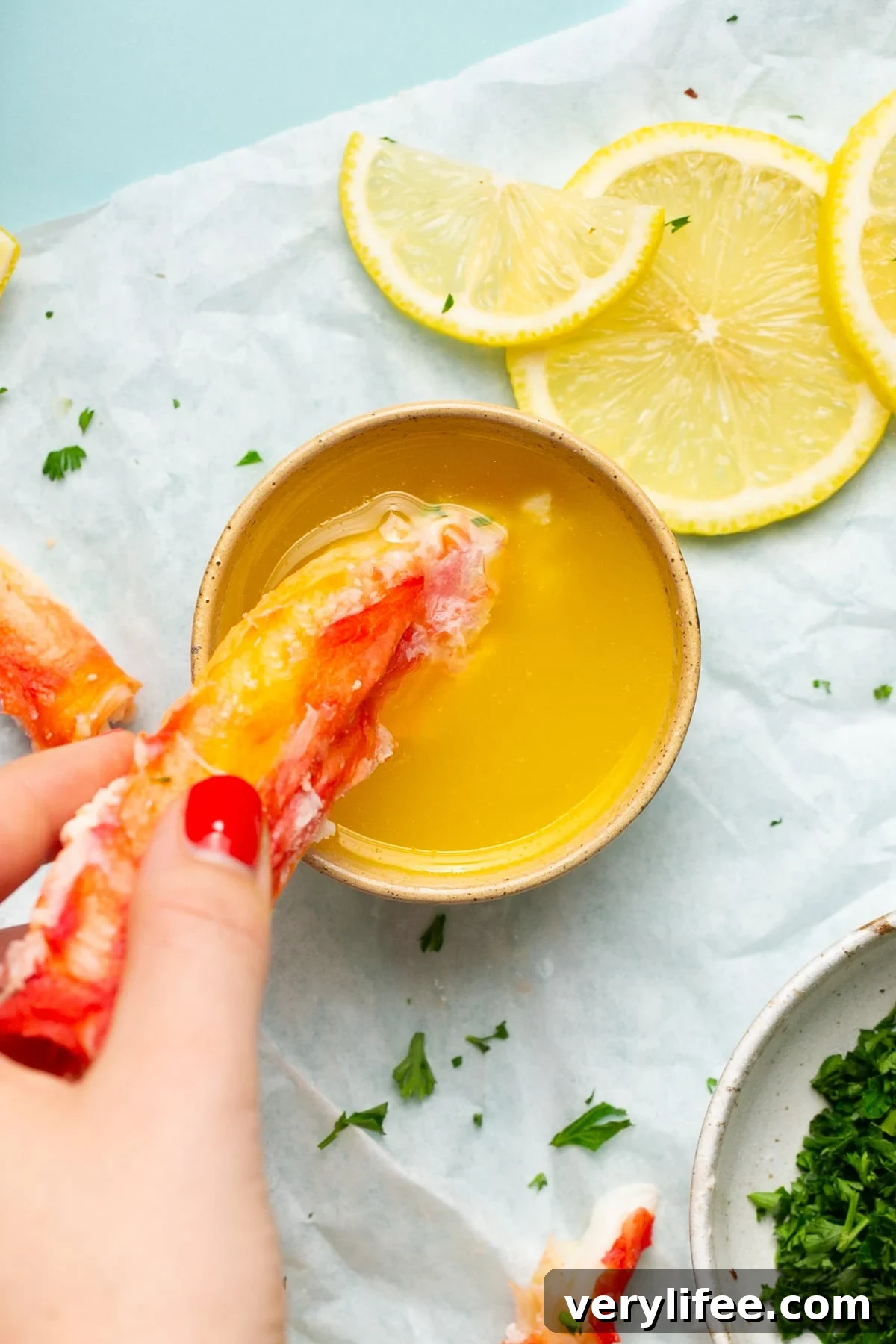 Crab Legs with melted butter and lemon wedges