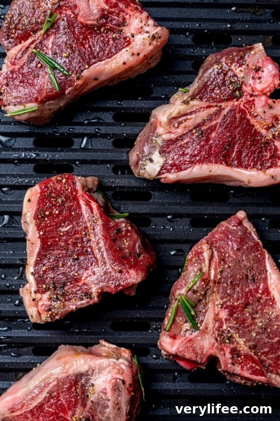 Grilled Rosemary Lamb Chops Recipe with Garlic and Lemon 8 Overhead view of raw lamb chops on grill pan