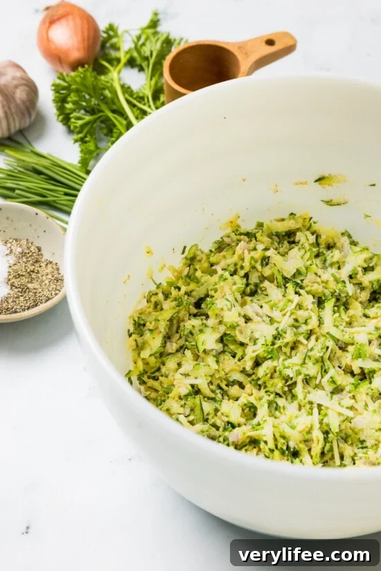 Grated zucchini in a bowl.
