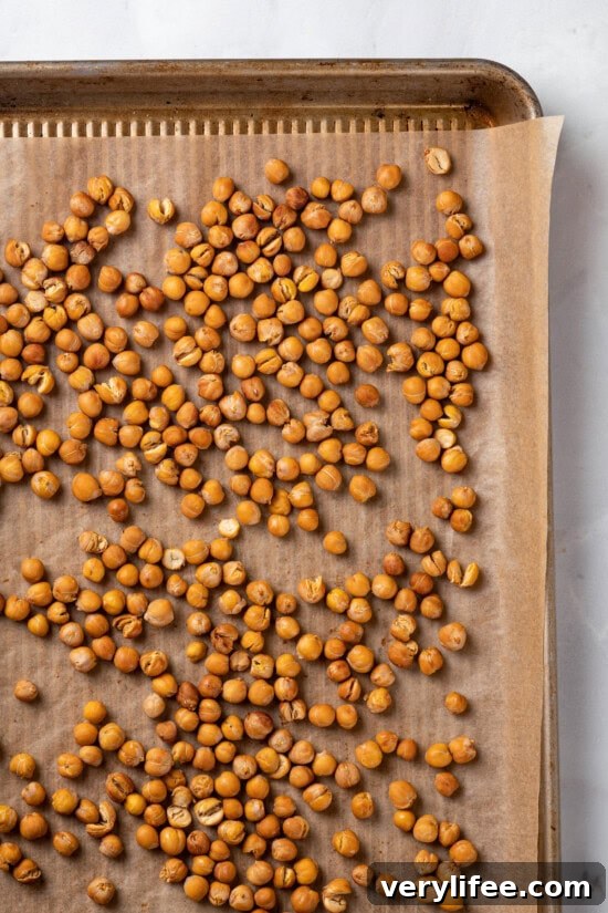 Crispy Roasted Chickpeas Recipe 3 Overhead view of roasted chickpeas on sheet pan