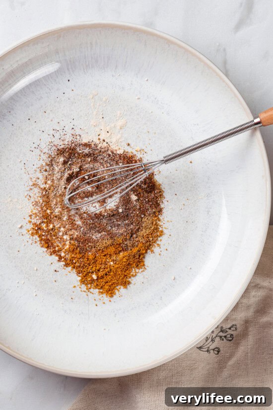 Crispy Roasted Chickpeas Recipe 4 Whisk mixing spices for chickpeas