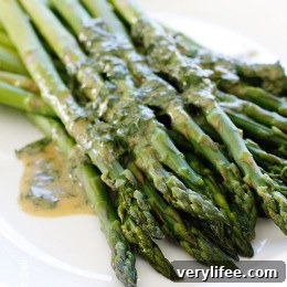 A simple asparagus side dish that really celebrates Spring. Serve it cold or room temperature, leftovers are wonderful chopped and mixed into a salad.
