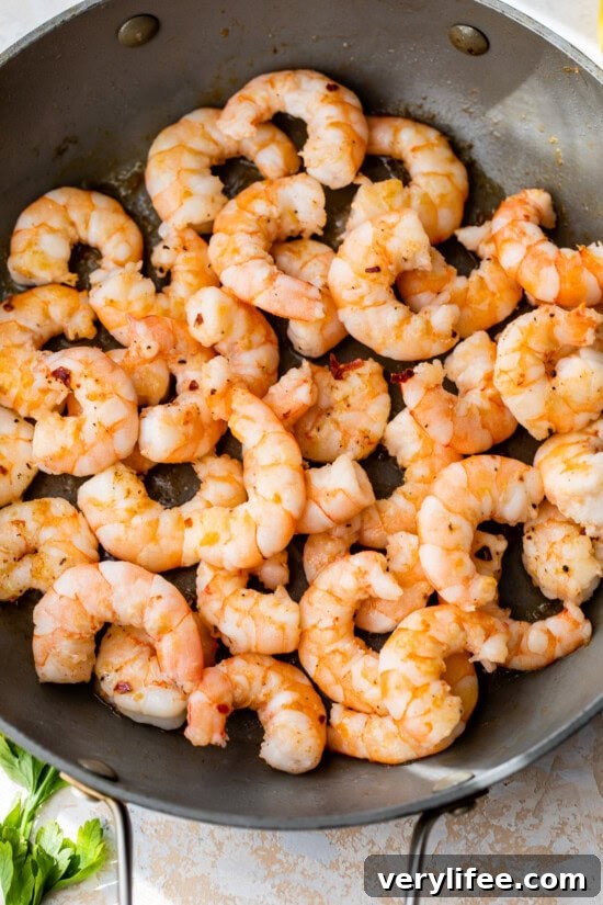 Pan-Seared Shrimp with Garlic Butter and Lemon 8 shrimp in skillet