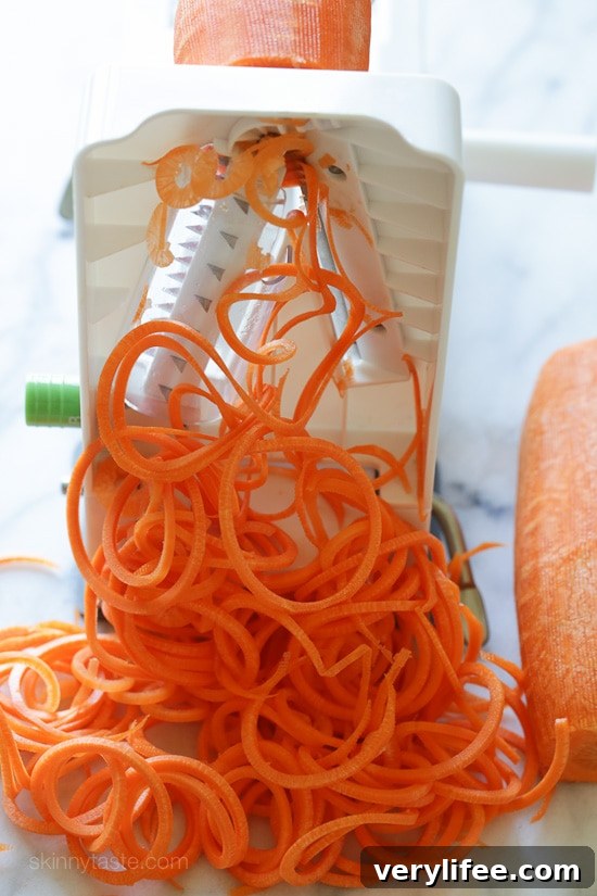 An easy 5-ingredient carrot salad that is lemony, bright and delicious! You don't need a spiralizer to make it, you can use pre-shredded carrots or use a potato peeler to cut the carrots into ribbons.
