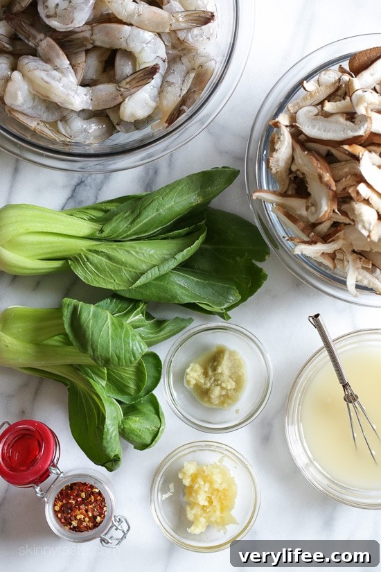 Raw ingredients of garlicky shrimp stir-fry with shiitakes and bok choy.