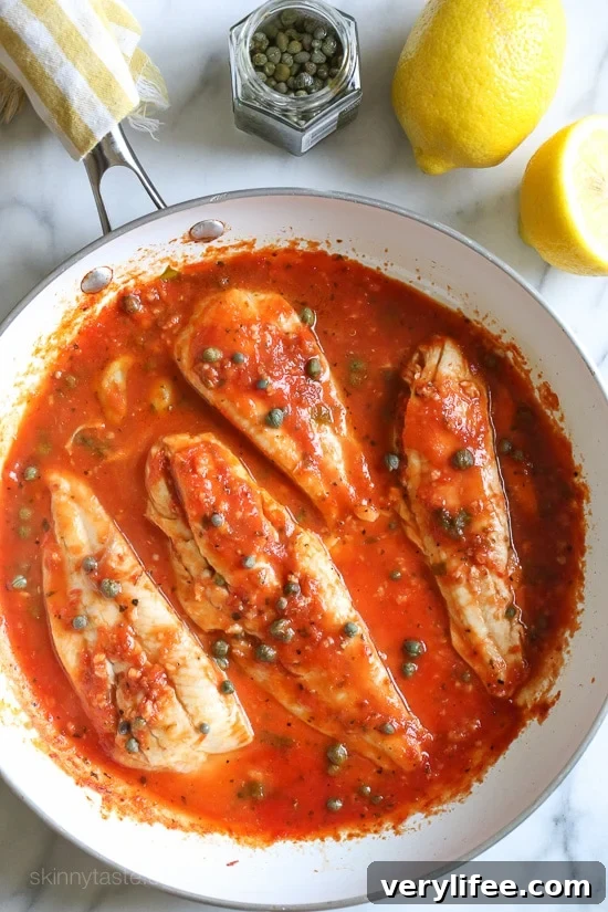 Pan-Seared Fish in Tomato, White Wine and Caper Sauce 8 Plated fish with tomato sauce and capers