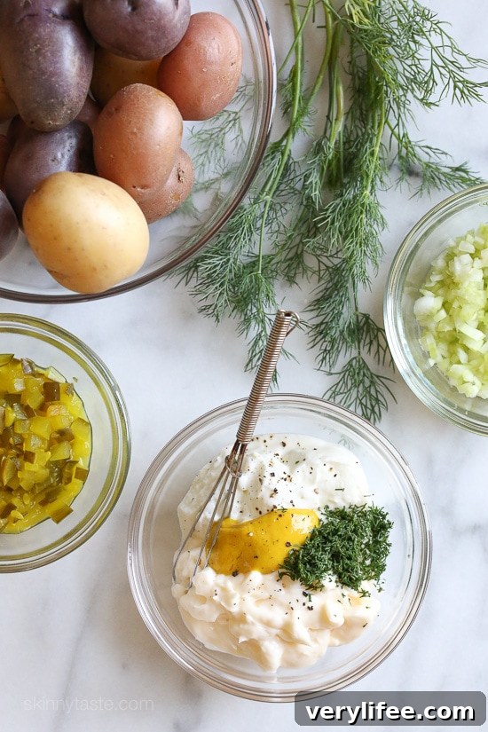Creamy potato salad with rainbow potatoes, celery and pickles