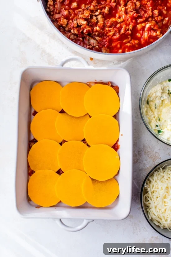 Butternut Squash Lasagna Without Noodles 5 Butternut Squash in a casserole dish with marinara sauce and cheese