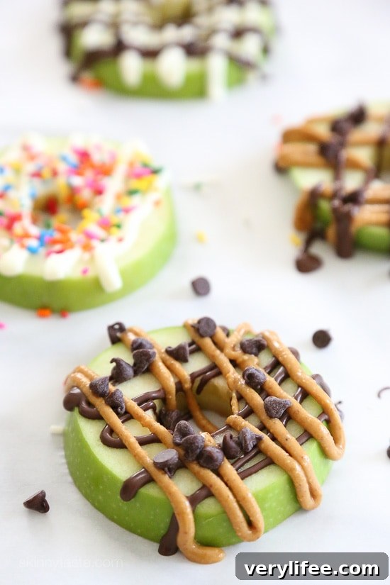 Apple Donuts Recipe: Cinnamon Ring Snacks for Kids 3 Apple donut slices ready to be drizzled with toppings