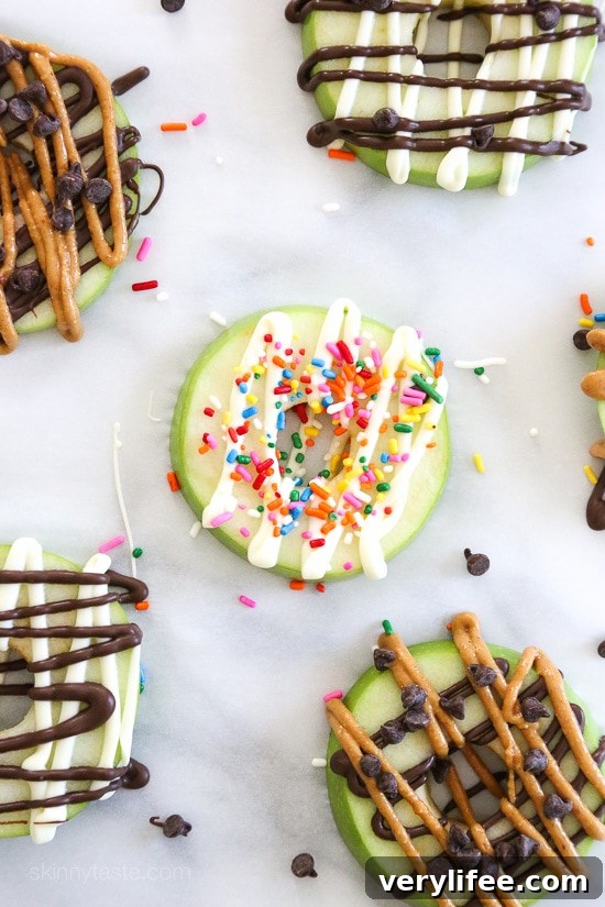 Apple Donuts Recipe: Cinnamon Ring Snacks for Kids 5 Apple donut topped with mini chocolate chips and sprinkles