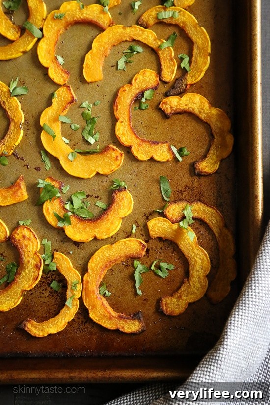 Roasted Delicata Squash with Turmeric Recipe 5 Roasted delicata squash arranged on a serving plate.