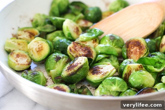 Crispy Buffalo Brussels Sprouts Recipe with Crumbled Blue Cheese 3 Buffalo Brussels sprouts finished with crumbled blue cheese, ready to serve