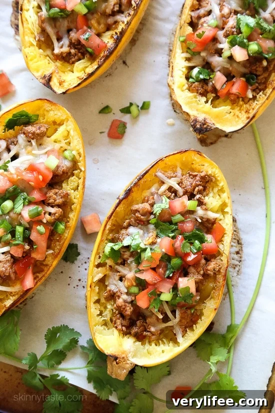 Turkey taco filling spooned into a roasted spaghetti squash