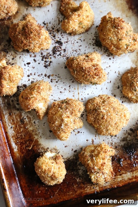 Oven-Baked Cauliflower Nuggets with Garlic-Parmesan Dip 3 Baked cauliflower nuggets with a golden parmesan-crumb crust