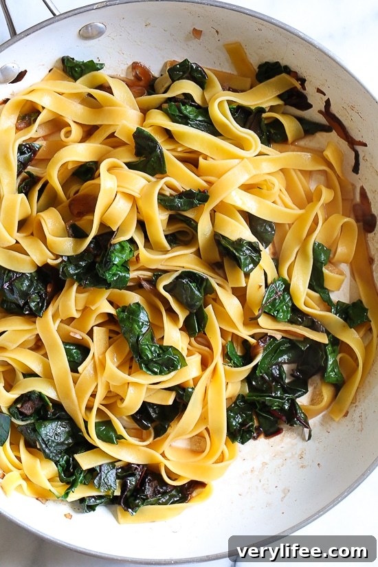 Pasta, greens and poached egg are one of my go-to, no-fuss weeknight combinations in the winter when I'm hungry and need dinner on the table quick. I always have eggs, pasta and some type of green vegetable on hand, for this I used Swiss chard, but spinach, escarole or kale would also work.
