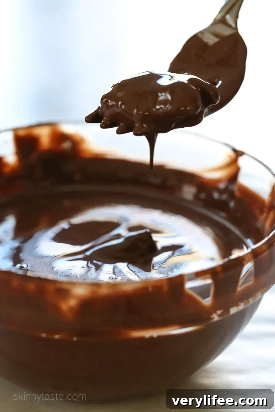 Almonds, pecans and walnuts are dipped in dark melted chocolate and finished with a touch of sea salt for the tastiest Holiday treats!