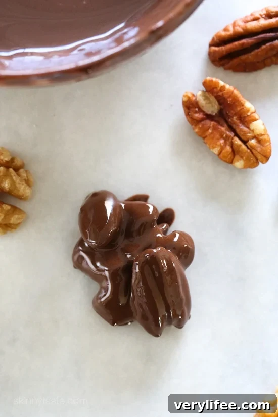 Almonds, pecans and walnuts are dipped in dark melted chocolate and finished with a touch of sea salt for the tastiest Holiday treats!
