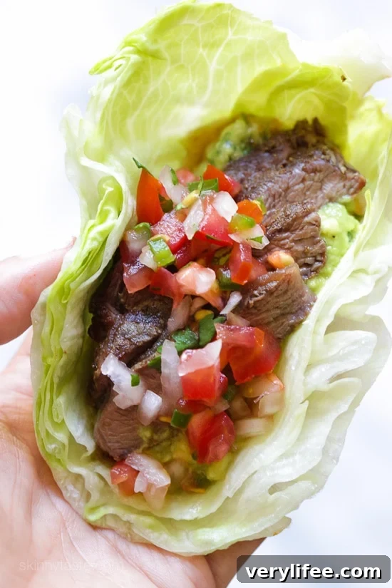 Grilled sirloin steak "flaco" tacos uses lettuce instead of tortillas! The steak is seasoned with cumin and spices, then grilled and sliced thin, along with guacamole and pico de gallo – low-carb and super delicious!