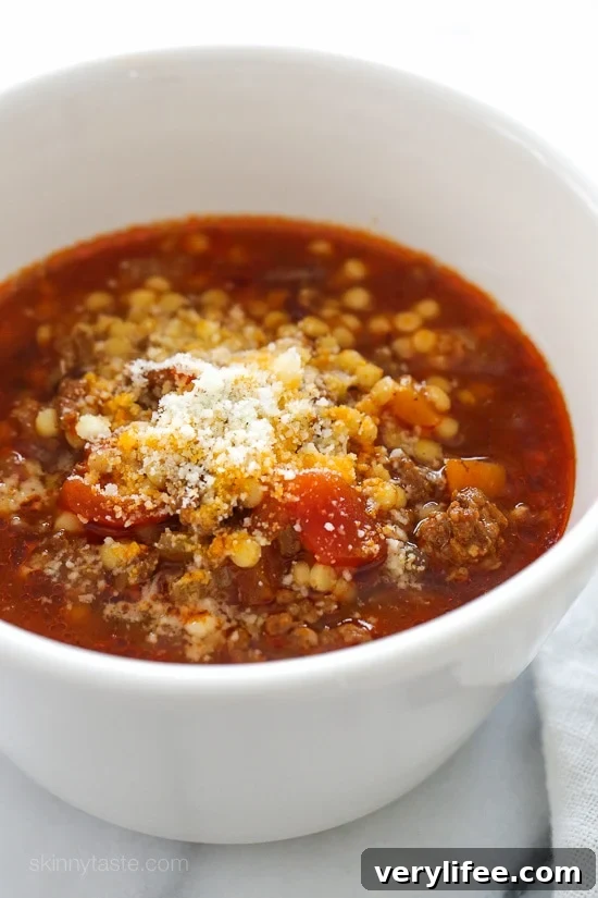 My family DEVOURED this delicious bowl of soup made with ground beef, tomatoes, and tiny pasta. It's warm and comforting, like a great big hug on a cold winter day. Kid-friendly, freezer-friendly!