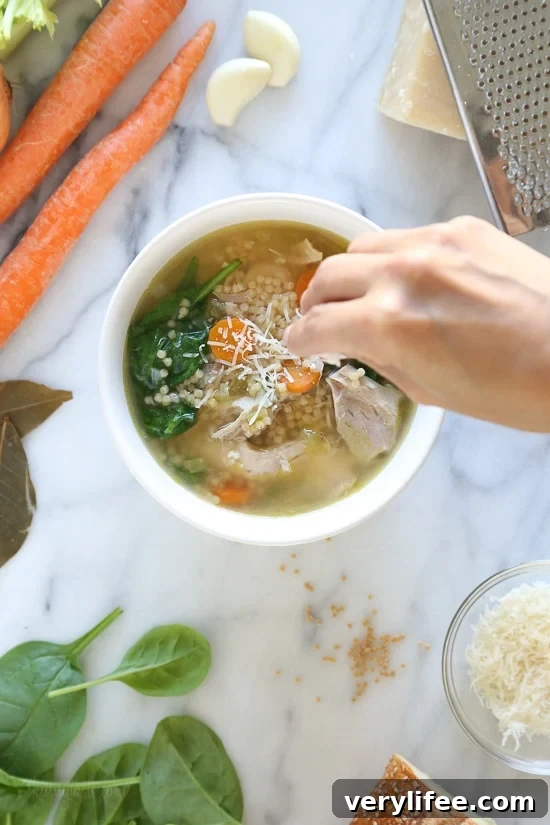 Homemade chicken soup with veggies and Acini di Pepe