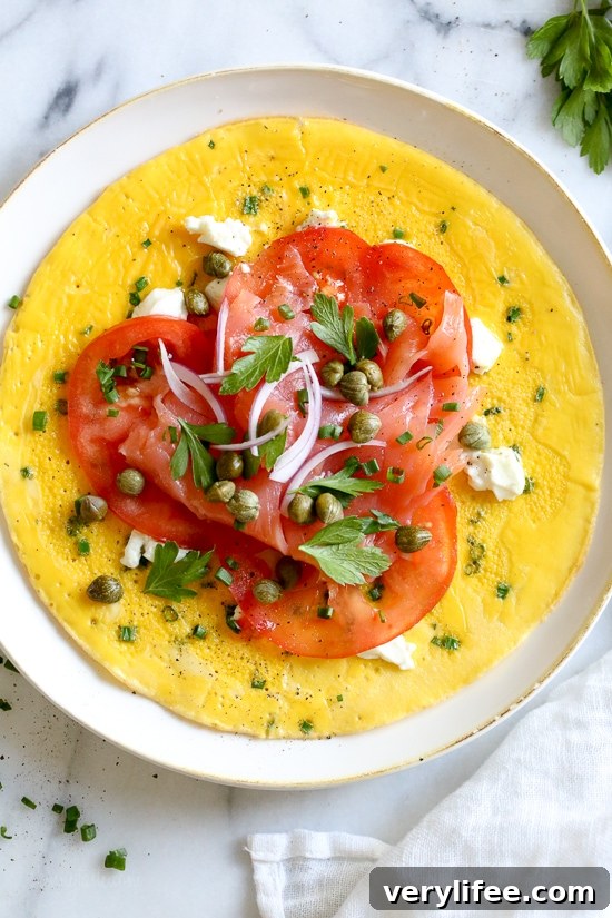 Nova Lox Omelet with Goat Cheese and Fresh Herbs 5 This Goat Cheese Herb Omelet topped with Nova Lox, sliced tomatoes and capers satisfies my bagel-and-lox craving, without the bagel! SO quick, takes about 5 minutes to make!