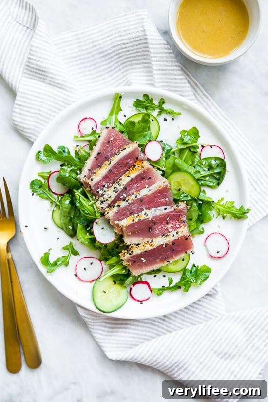 Seared tuna sliced and served on arugula and spinach