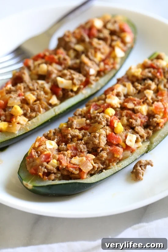 Colombian-Style Stuffed Zucchini Recipe 3 Colombian-Style Zucchini Rellenos - halved zucchinis hollowed and ready to fill