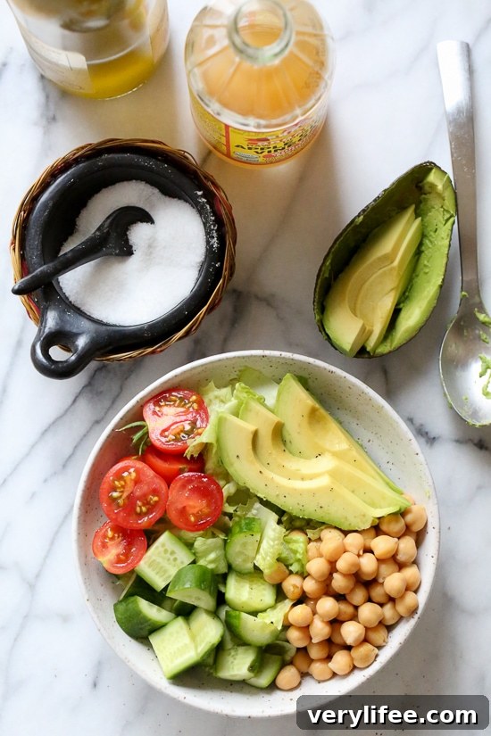 This Chickpea and Avocado salad is my go-to lunch when I need something fast and healthy! I load it up with garden vegetables and top it with a little olive oil and lemon, or olive oil and vinegar depending on my mood. Super simple, fresh and fills me up!
