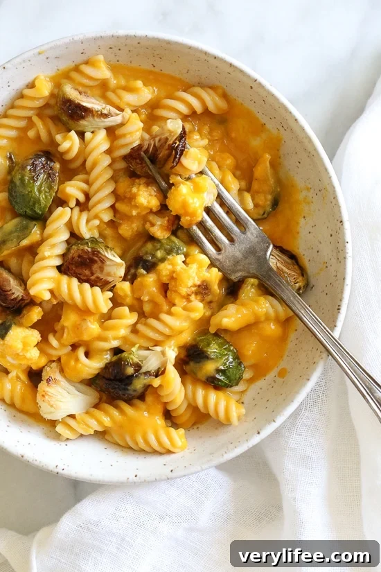 Creamy Pumpkin Mac and Cheese with Roasted Vegetables 3 Creamy, Pumpkin Mac and Cheese with Roasted Veggies is comfort food, in a bowl! Made with pumpkin puree, roasted cauliflower and Brussels sprouts.