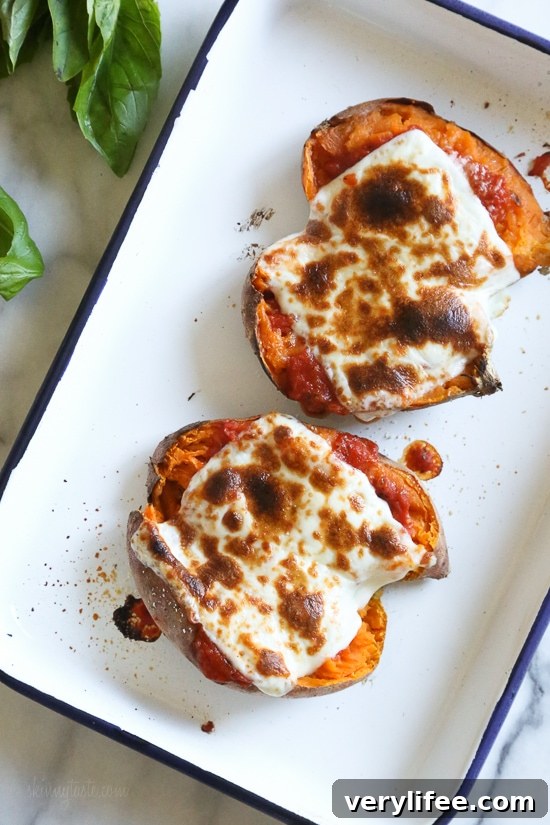 Italian-Style Stuffed Sweet Potatoes with Mozzarella and Basil 7 Plate of stuffed sweet potato served with arugula salad.
