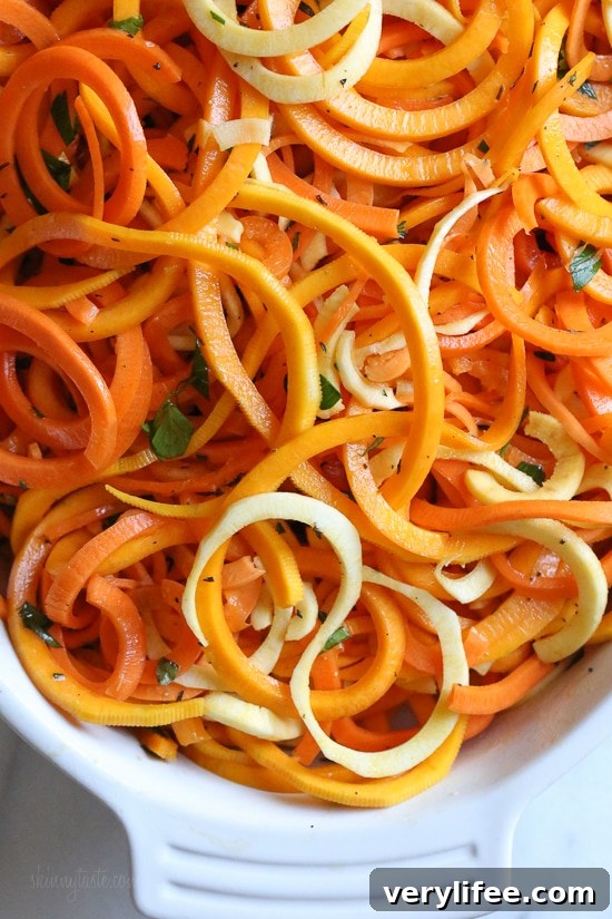 Spiralized Winter Vegetable Gratin with Parmesan and Herbs 3 Roasted spiralized winter vegetables in a casserole dish.