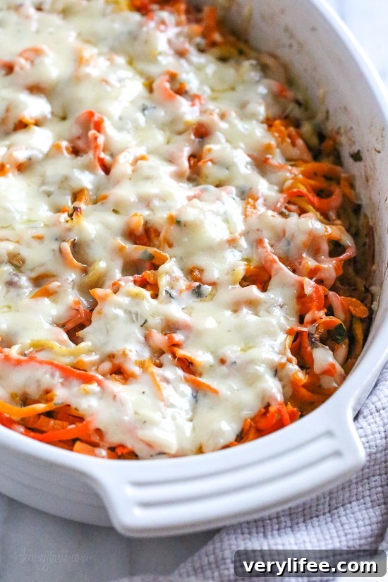 Spiralized Winter Vegetable Gratin with Parmesan and Herbs 5 Creamy white sauce being mixed for gratin.