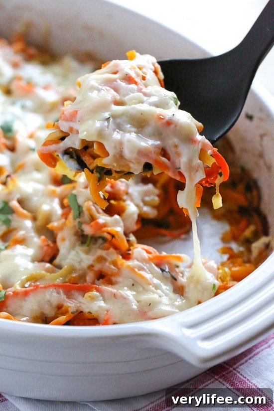 Spiralized Winter Vegetable Gratin with Parmesan and Herbs 9 Close-up of gratin showing tender vegetable ribbons.